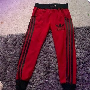 Red with black stripes Adidas sweat pants